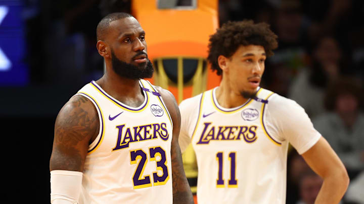 Nov 26, 2024; Phoenix, Arizona, USA; Los Angeles Lakers forward LeBron James (23) and center Jaxson Hayes (11) against the Phoenix Suns during an NBA Cup game at Footprint Center. Mandatory Credit: Mark J. Rebilas-Imagn Images