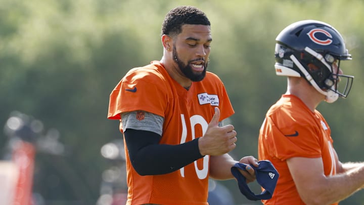 Chicago Bears quarterback Caleb Williams (18) dances on the field during training camp at Halas Hall.