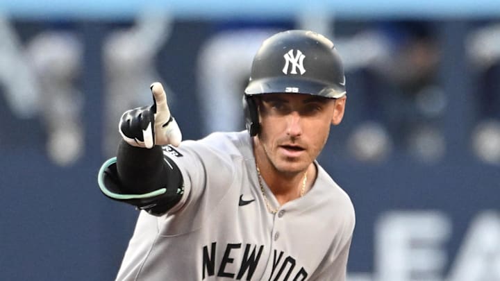 Jul 22, 2025; Toronto, Ontario, CAN;   New York Yankees left fielder Cody Bellinger (35) reacts after hitting a double against the Toronto Blue Jays in the third inning at Rogers Centre. Mandatory Credit: Dan Hamilton-Imagn Images