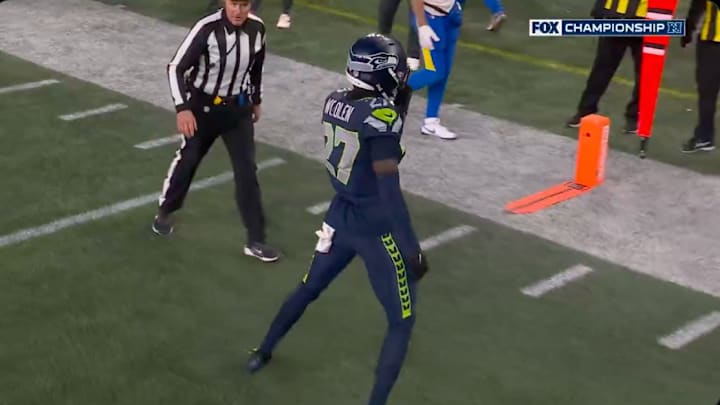 Seahawks CB Tariq Woolen was flagged for unsportsmanlike conduct after taunting the Rams bench. 