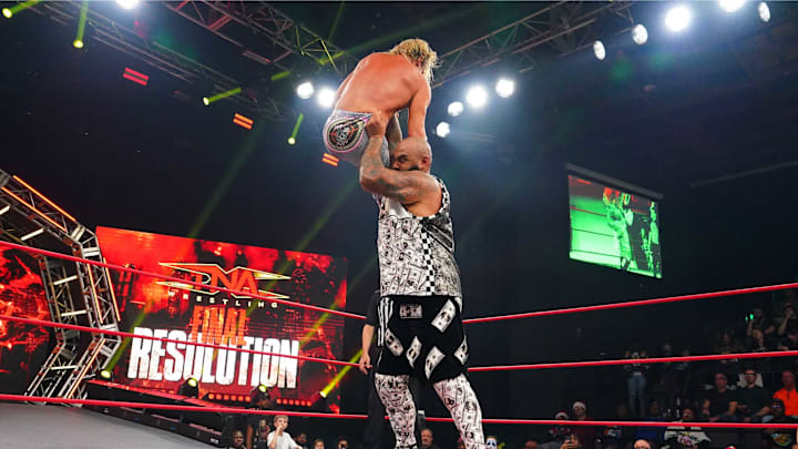 AJ Francis chokeslams TNA World Champion Nic Nemeth.