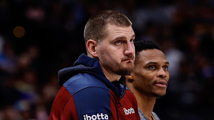 Dec 27, 2024; Denver, Colorado, USA; Denver Nuggets center Nikola Jokic (15) and guard Russell Westbrook (4) look on in the second quarter against the Cleveland Cavaliers at Ball Arena. Mandatory Credit: Isaiah J. Downing-Imagn Images