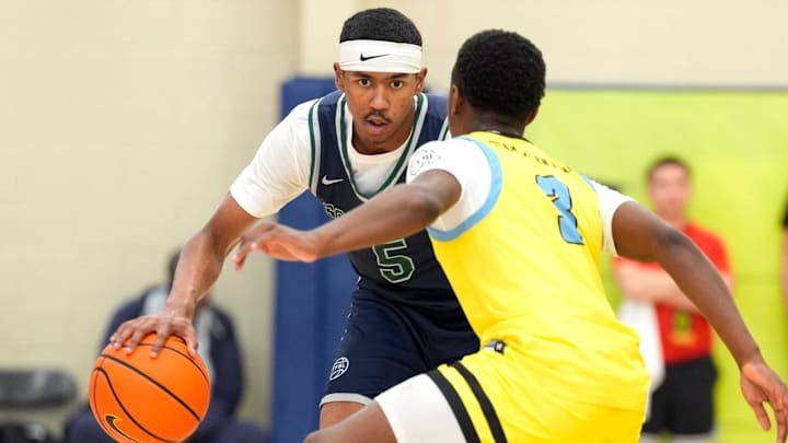 July 15, 2025; North Augusta, South Carolina, USA; Oakland Soldiers Jason Crowe Jr. (5) dribbles as Team Final RJ Smith (3) defends during the Oakland Soldiers and Team Final game at Nike EYBL Peach Jam at Riverview Park Activities Center. The Oakland Soldiers won 86-75. Mandatory Credit: Katie Goodale - Augusta Chronicle/USA TODAY NETWORK