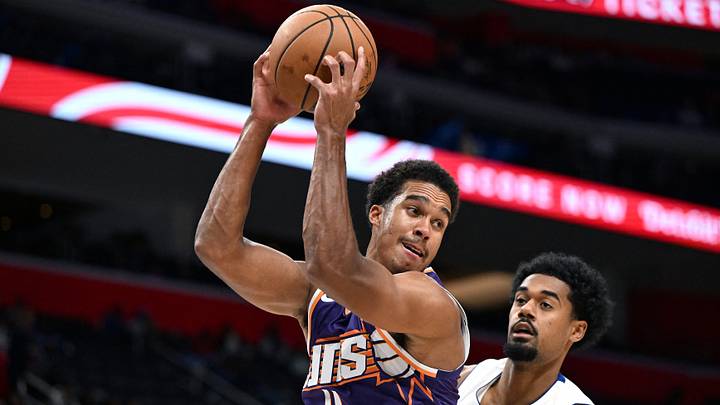 Oct 5, 2026; Detroit, Michigan, USA; Phoenix Suns forward Oso Ighodaro (11) pulls down a rebound in front of Detroit Pistons forward Tolu Smith (35) in the second quarter at Little Caesars Arena. Mandatory Credit: Lon Horwedel-Imagn Images Oct 5, 2026; Detroit, Michigan, USA; Phoenix Suns forward Oso Ighodaro (11) pulls down a rebound in front of Detroit Pistons forward Tolu Smith (35) in the second quarter at Little Caesars Arena. Mandatory Credit: Lon Horwedel-Imagn Images