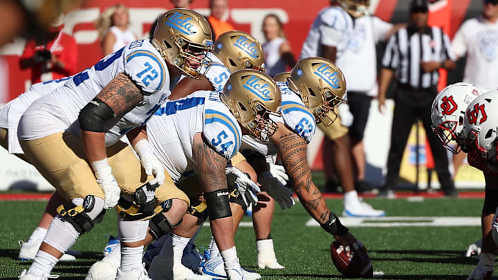 Sep 23, 2023; Salt Lake City, Utah, USA; UCLA Bruins offense lines up against the Utah Utes defense in the fourth quarter at Rice-Eccles Stadium. Mandatory Credit: Rob Gray-Imagn Images