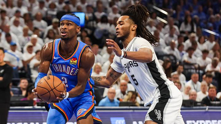 May 20, 2026; Oklahoma City, Oklahoma, USA; Oklahoma City Thunder guard Shai Gilgeous-Alexander (2) drives to the basket as San Antonio Spurs guard Stephon Castle (5) defends during the third quarter during Game 2 of the Western Conference Finals for the 2026 NBA Playoffs at Paycom Center.