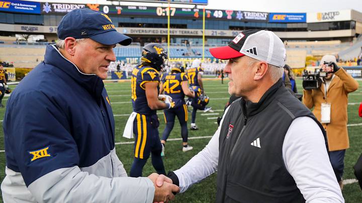 Nov 29, 2025; Morgantown, West Virginia, USA; West Virginia Mountaineers head coach Rich Rodriguez talks with Texas Tech Red Raiders head coach Joey McGuire after the game at Milan Puskar Stadium. Mandatory Credit: Ben Queen-Imagn Images Nov 29, 2025; Morgantown, West Virginia, USA; West Virginia Mountaineers head coach Rich Rodriguez talks with Texas Tech Red Raiders head coach Joey McGuire after the game at Milan Puskar Stadium. Mandatory Credit: Ben Queen-Imagn Images