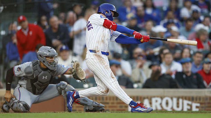 May 13, 2025; Chicago, Illinois, USA; Chicago Cubs center fielder Pete Crow-Armstrong (4) hits a solo home run against the Miami Marlins during the third inning at Wrigley Field.