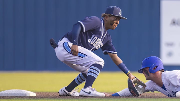 Westlake Chaparrals' Blake Peterson slides into second base ahead of the tag from SA Johnson Jaguars' Kayson Cunningham at the UIL Regional IV Final 6A baseball Round 1 playoff on June 1, 2023, at Westlake High School in West Lake Hills, TX.