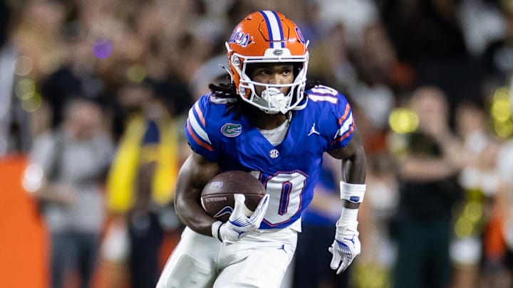 Oct 5, 2024; Gainesville, Florida, USA; Florida Gators wide receiver Tank Hawkins (10) runs with the ball against the UCF Knights during the first half at Ben Hill Griffin Stadium. Mandatory Credit: Matt Pendleton-Imagn Images