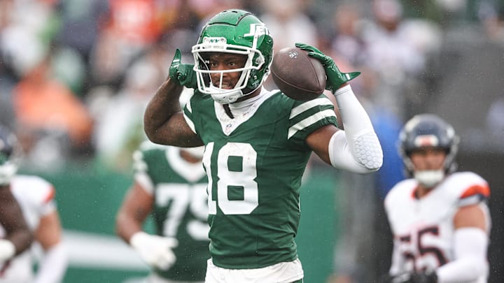 Sep 29, 2024; East Rutherford, New Jersey, USA; New York Jets wide receiver Mike Williams (18) celebrates a first down reception during the second half against the Denver Broncos at MetLife Stadium. Mandatory Credit: Vincent Carchietta-Imagn Images
