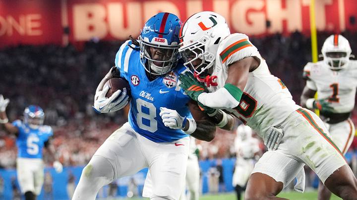 Ole Miss Rebels tight end Dae'Quan Wright (8) scores a touchdown past Miami Hurricanes defensive back Ja'Boree Antoine (16) during their Vrbo Fiesta Bowl matchup at State Farm Stadium on Jan. 8, 2026. Ole Miss Rebels tight end Dae'Quan Wright (8) scores a touchdown past Miami Hurricanes defensive back Ja'Boree Antoine (16) during their Vrbo Fiesta Bowl matchup at State Farm Stadium on Jan. 8, 2026.