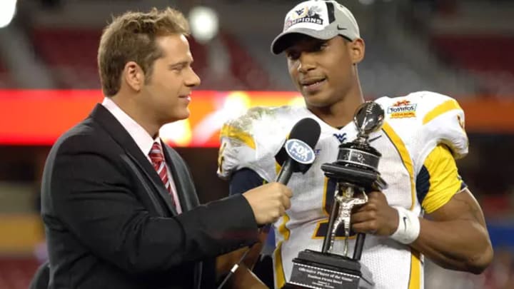 Former WVU QB Pat White holding the Fiesta Bowl trophy. Former WVU QB Pat White holding the Fiesta Bowl trophy.