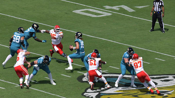 Jacksonville Jaguars quarterback Trevor Lawrence (16) is pressured by Kansas City Chiefs defensive