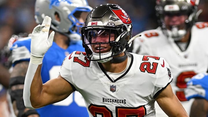 Sep 15, 2024; Detroit, Michigan, USA;  Tampa Bay Buccaneers cornerback Zyon McCollum (27) celebrates after interception Detroit Lions quarterback Jared Goff (16) on the Lions first offensive play of the game in the  first quarter at Ford Field. Mandatory Credit: Lon Horwedel-Imagn Images