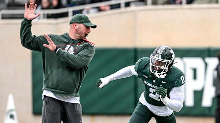 Michigan State's Khris Bogle, right, runs a drill with rush ends coach Chad Wilt during the Spring Showcase on Saturday, April 20, 2024, at Spartan Stadium in East Lansing.