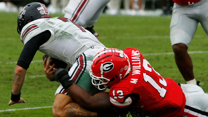 Georgia defensive lineman Mykel Williams (13) sacks South Carolina quarterback Spencer Rattler (7) during the second half of a NCAA college football game against South Carolina in Athens, Ga., on Saturday, Sept. 16, 2023. Georgia won 24-14. Georgia defensive lineman Mykel Williams (13) sacks South Carolina quarterback Spencer Rattler (7) during the second half of a NCAA college football game against South Carolina in Athens, Ga., on Saturday, Sept. 16, 2023. Georgia won 24-14.