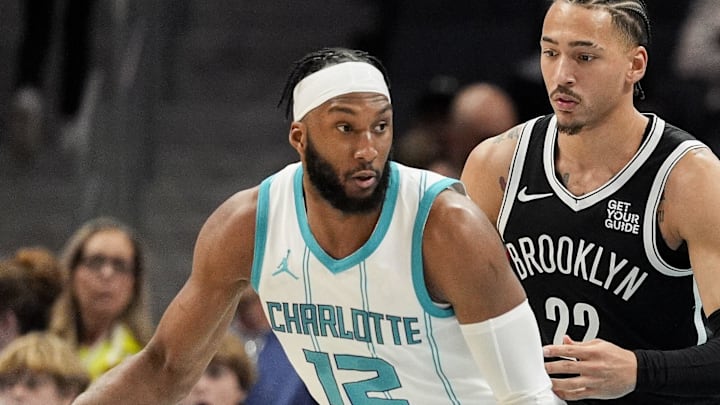 Jan 29, 2025; Charlotte, North Carolina, USA; Charlotte Hornets forward Josh Okogie (12) handles the ball against Brooklyn Nets forward Jalen Wilson (22) during the second quarter at Spectrum Center. Mandatory Credit: Jim Dedmon-Imagn Images Jan 29, 2025; Charlotte, North Carolina, USA; Charlotte Hornets forward Josh Okogie (12) handles the ball against Brooklyn Nets forward Jalen Wilson (22) during the second quarter at Spectrum Center. Mandatory Credit: Jim Dedmon-Imagn Images