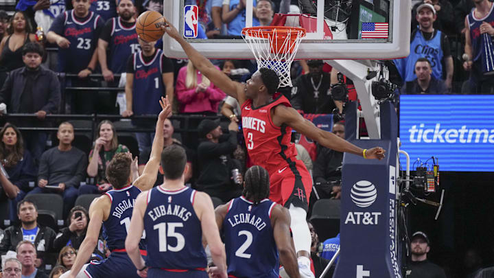 Apr 9, 2025; Inglewood, California, USA; Houston Rockets center N'Faly Dante (3) block Los Angeles Clippers guard Bogdan Bogdanovic (10) in the second half at Intuit Dome. Mandatory Credit: Kirby Lee-Imagn Images