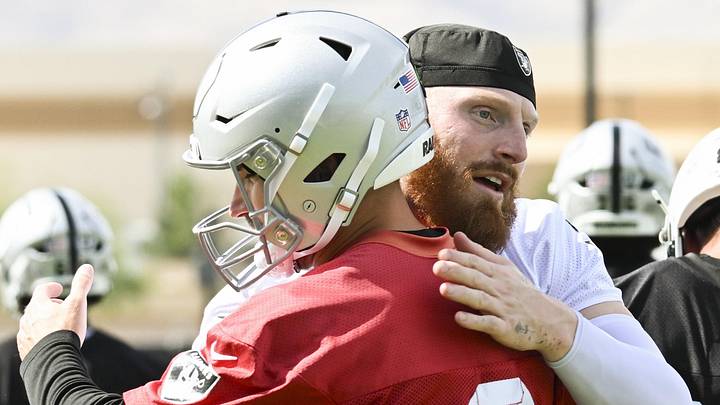 Jun 3, 2026; Henderson, NV, USA; Las Vegas Raiders defensive end Maxx Crosby (98) hugs quarterback Kirk Cousins (8) during organized team activities at Intermountain Health Performance Center. Mandatory Credit: Candice Ward-Imagn Images