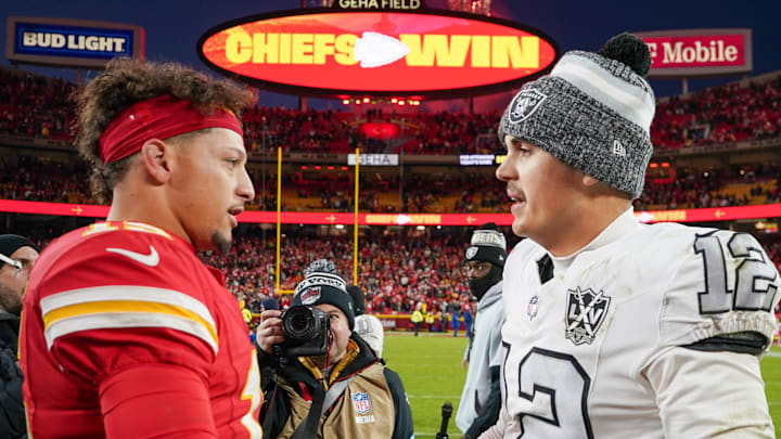 Nov 29, 2024; Kansas City, Missouri, USA; Kansas City Chiefs quarterback Patrick Mahomes (15) shakes hands with Las Vegas Raiders quarterback Aidan O'Connell (12) after the game at GEHA Field at Arrowhead Stadium. Mandatory Credit: Denny Medley-Imagn Images