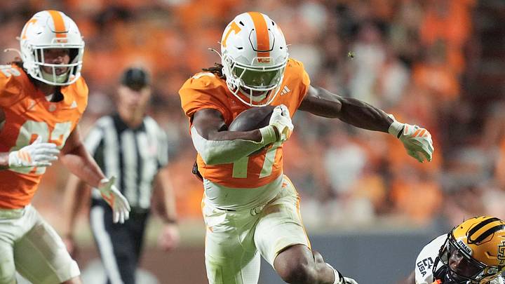 Tennessee running back Daune Morris (17) carries the ball while grabbed by Kennesaw State defensive back Perry Fisher (0) during a college football game on Sept. 19, 2026, in Knoxville, Tennessee. Tennessee running back Daune Morris (17) carries the ball while grabbed by Kennesaw State defensive back Perry Fisher (0) during a college football game on Sept. 19, 2026, in Knoxville, Tennessee.