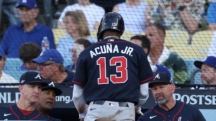 Oct 4, 2026; Los Angeles, California, USA;  Atlanta Braves outfielder Ronald Acuna Jr. (13) celebrates with manager Walt Weiss after scoring during the first inning against the Los Angeles Dodgers game two of the NLDS for the 2026 MLB Playoffs at Uniqlo Field at Dodger Stadium.  Mandatory Credit: Kiyoshi Mio-Imagn Images