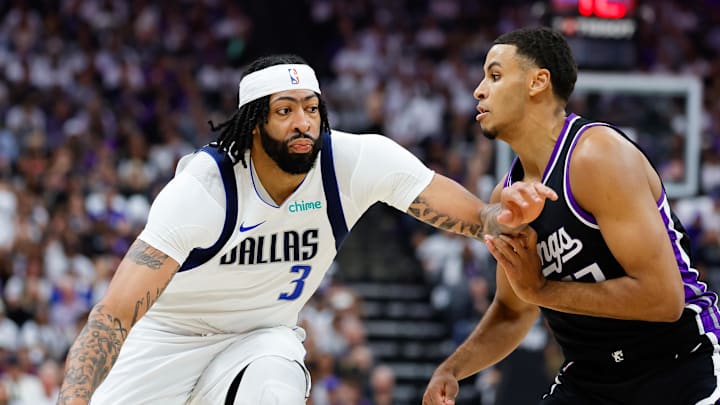 Apr 16, 2025; Sacramento, California, USA; Dallas Mavericks forward Anthony Davis (3) dribbles the ball against Sacramento Kings forward Keegan Murray (13) during the first quarter at Golden 1 Center. Mandatory Credit: Sergio Estrada-Imagn Images