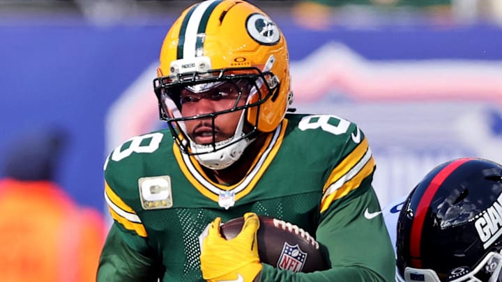 Green Bay Packers running back Josh Jacobs (8) runs the ball against New York Giants defensive tackle Roy Robertson-Harris.