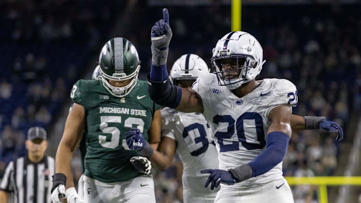 Nov 24, 2023; Detroit, Michigan, USA; Penn State Nittany Lions defensive end Adisa Isaac (20) celebrates a sack of Michigan State Spartans quarterback Katin Houser (12) during the second half at Ford Field. Mandatory Credit: David Reginek-Imagn Images