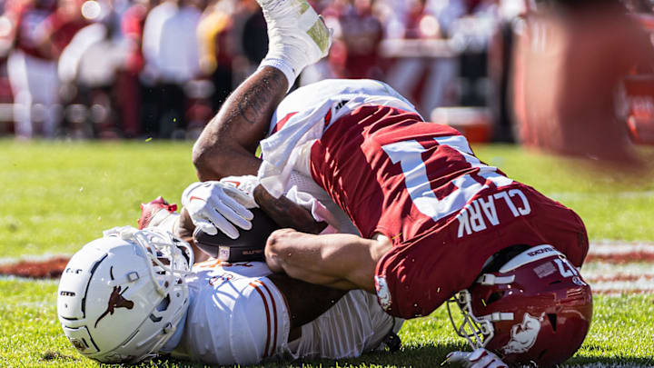 Hudson Clark (17) attempts to punch the ball away from a Texas Longhorn. The Longhorns won 20-10 at Razorback Stadium in Fayetteville, Ark.