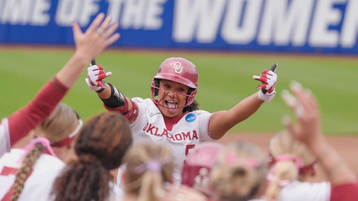 Oklahoma Sooner Ella Parker (5) celebrates her home run against Tennessee.