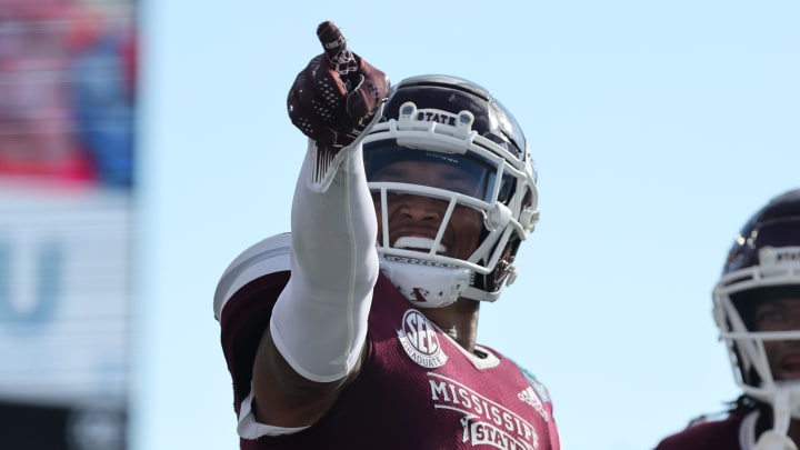 Mississippi State Bulldogs safety Collin Duncan (19) celebrates with cornerback Decamerion Richardson (3) against the Illinois Fighting Illini during the second half in the 2023 ReliaQuest Bowl at Raymond James Stadium.