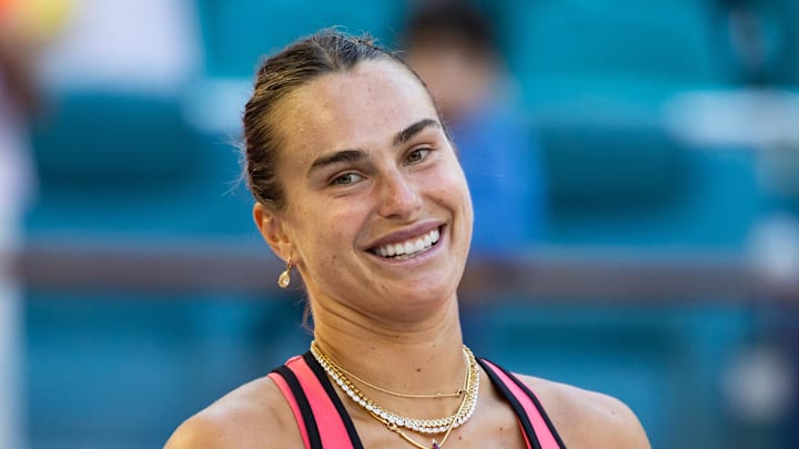 Aryna Sabalenka poses with the Butch Buchholz Championship trophy
