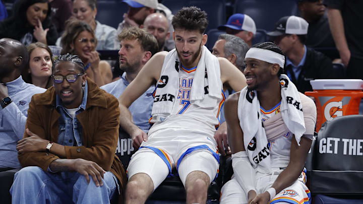 Nov 12, 2025; Oklahoma City, Oklahoma, USA; Oklahoma City Thunder guard Jalen Williams (8), center Chet Holmgren (7), and guard Shai Gilgeous-Alexander (2) talk while sitting on the bench during the fourth quarter against the Los Angeles Lakers at Paycom Center. Mandatory Credit: Alonzo Adams-Imagn Images Nov 12, 2025; Oklahoma City, Oklahoma, USA; Oklahoma City Thunder guard Jalen Williams (8), center Chet Holmgren (7), and guard Shai Gilgeous-Alexander (2) talk while sitting on the bench during the fourth quarter against the Los Angeles Lakers at Paycom Center. Mandatory Credit: Alonzo Adams-Imagn Images