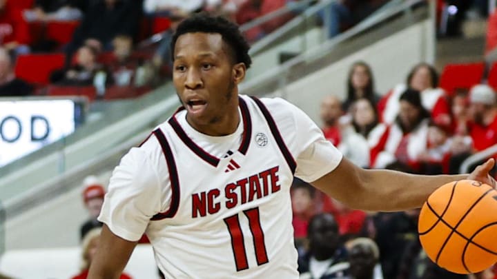Dec 6, 2025; Raleigh, North Carolina, USA; NC State Wolfpack guard Quadir Copeland (11) dribbles down the court during the first half of the game against UNC Asheville Bulldogs at Lenovo Center. Mandatory Credit: Jaylynn Nash-Imagn Images