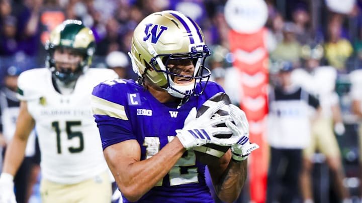 Aug 30, 2025; Seattle, Washington, USA; Washington Huskies wide receiver Denzel Boston (12) catches a pass against the Colorado State Rams during the second quarter at Husky Stadium. Mandatory Credit: Joe Nicholson-Imagn Images
