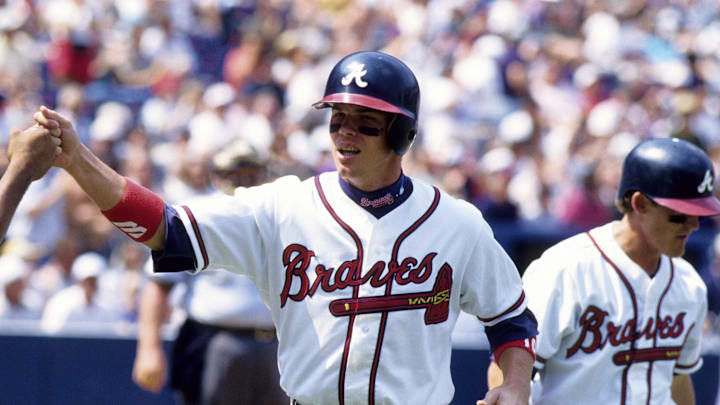 1997, Atlanta, GA, USA; FILE PHOTO; Atlanta Braves third baseman Chipper Jones fist bumps a teammate during the 1997 season at Turner Field. Mandatory Credit: RVR Photos-Imagn Images