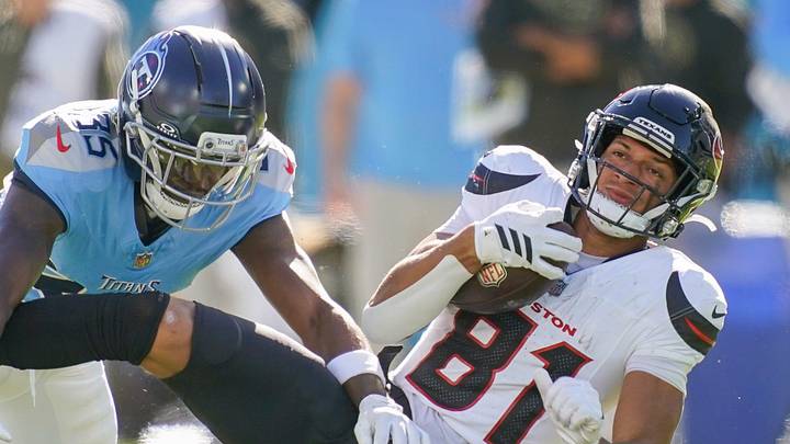 Houston Texans wide receiver Jayden Higgins (81) is stopped by Tennessee Titans cornerback Samuel Womack (35) during the second quarter at Nissan Stadium in Nashville, Tenn., Sunday, Nov. 16, 2025.