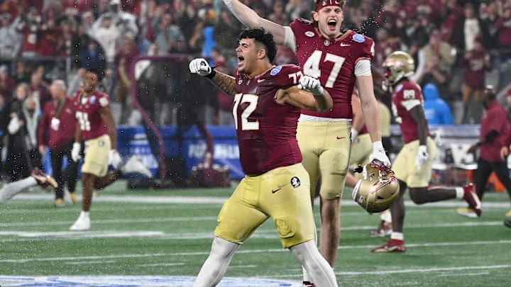 Dec 2, 2023; Charlotte, NC, USA; Florida State Seminoles offensive lineman Julian Armella (72) and tight end Jimmy Casey (47) celebrate winning the ACC Championship against the Louisville Cardinals at Bank of America Stadium. Mandatory Credit: Bob Donnan-Imagn Images