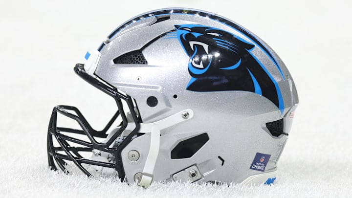 Detailed shot of a Carolina Panthers helmet on the grass before the game 