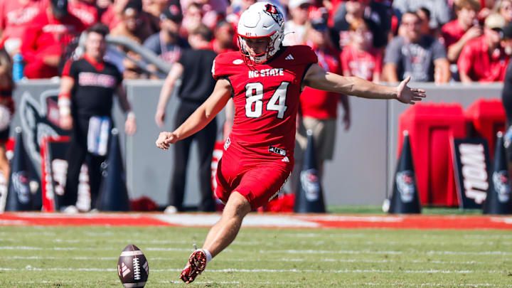 Oct 4, 2025; Raleigh, North Carolina, USA;  NC State Wolfpack kicker Charlie Birtwistle (84) kicks the ball during the first half of the game against Campbell Fighting Camels at Carter-Finley Stadium. Mandatory Credit: Jaylynn Nash-Imagn Images
