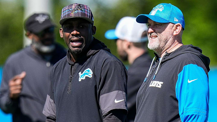 Detroit Lions wide receivers coach Scottie Montgomery, left, talk to offensive coordinator John Morton Detroit Lions wide receivers coach Scottie Montgomery, left, talk to offensive coordinator John Morton