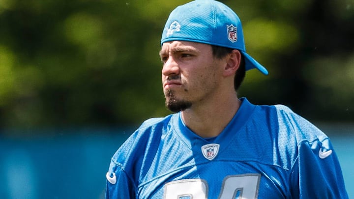Former Detroit Lions place kicker John Parker Romo (24) watches practice during OTAs at Detroit Lions headquarters in Allen Park on Thursday, June 1, 2023.