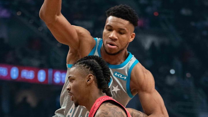 Team Durant's Ja Morant of the Memphis Grizzlies dribbles the basketball against Team LeBron forward Giannis Antetokounmpo