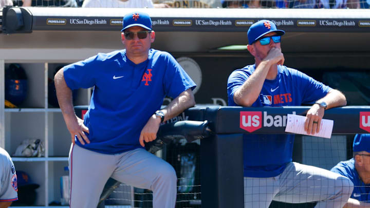 Jul 30, 2025; San Diego, California, USA; New York Mets manager Carlos Mendoza (64) watches play during the seventh inning against the San Diego Padres at Petco Park. 