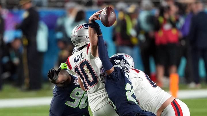 Feb 8, 2026; Santa Clara, CA, USA; Seattle Seahawks cornerback Devon Witherspoon (center right) forces a fumble by New England Patriots quarterback Drake Maye (10) during the fourth quarter in Super Bowl LX at Levi's Stadium. Mandatory Credit: Darren Yamashita-Imagn Images Feb 8, 2026; Santa Clara, CA, USA; Seattle Seahawks cornerback Devon Witherspoon (center right) forces a fumble by New England Patriots quarterback Drake Maye (10) during the fourth quarter in Super Bowl LX at Levi's Stadium. Mandatory Credit: Darren Yamashita-Imagn Images