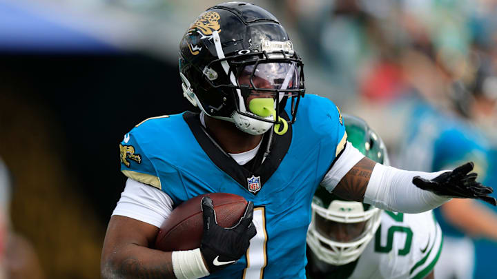 Jacksonville Jaguars running back Travis Etienne Jr. (1) rushes for yards during the second quarter Sunday, Dec. 15, 2024 at EverBank Stadium in Jacksonville, Fla. [Corey Perrine/Florida Times-Union]