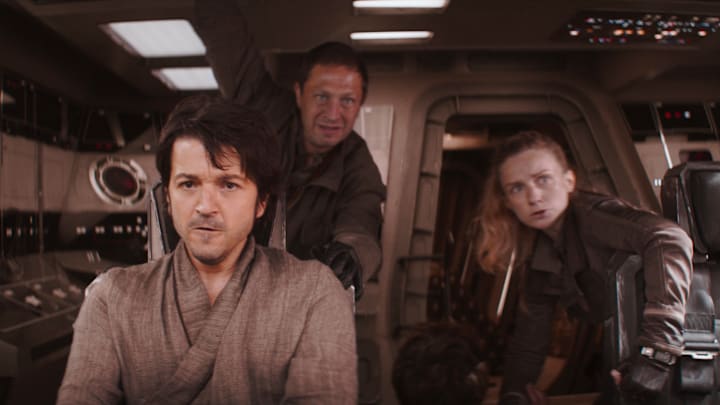 (L-R): Cassian Andor (Diego Luna), Arvel Skeen (Ebon Moss-Bachrach), Karis Nemik (Alex Lawther, seated) and Vel Sartha (Faye Marsay) in Lucasfilm's ANDOR, exclusively on Disney+. ©2022 Lucasfilm Ltd. & TM. All Rights Reserved.