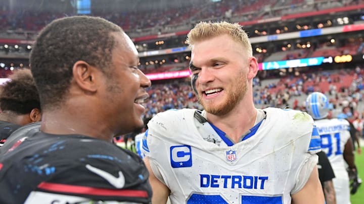 Detroit Lions defensive end Aidan Hutchinson (97) and Arizona Cardinals linebacker Julian Okwara (58) talk Detroit Lions defensive end Aidan Hutchinson (97) and Arizona Cardinals linebacker Julian Okwara (58) talk